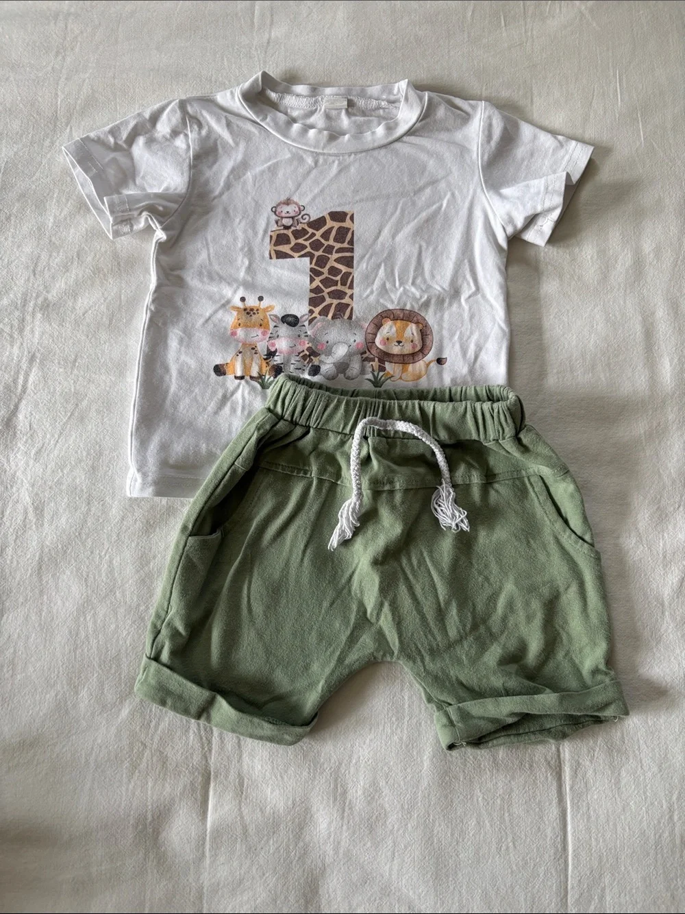 12m baby boy clothing bundle. 3 pair pajamas, 5 outfits, 2pairs pants, 1swimsuit